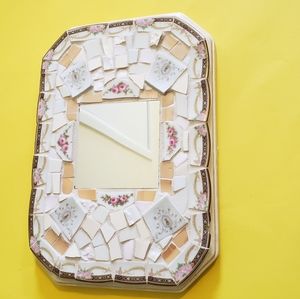 Genuine pique assiette mirror